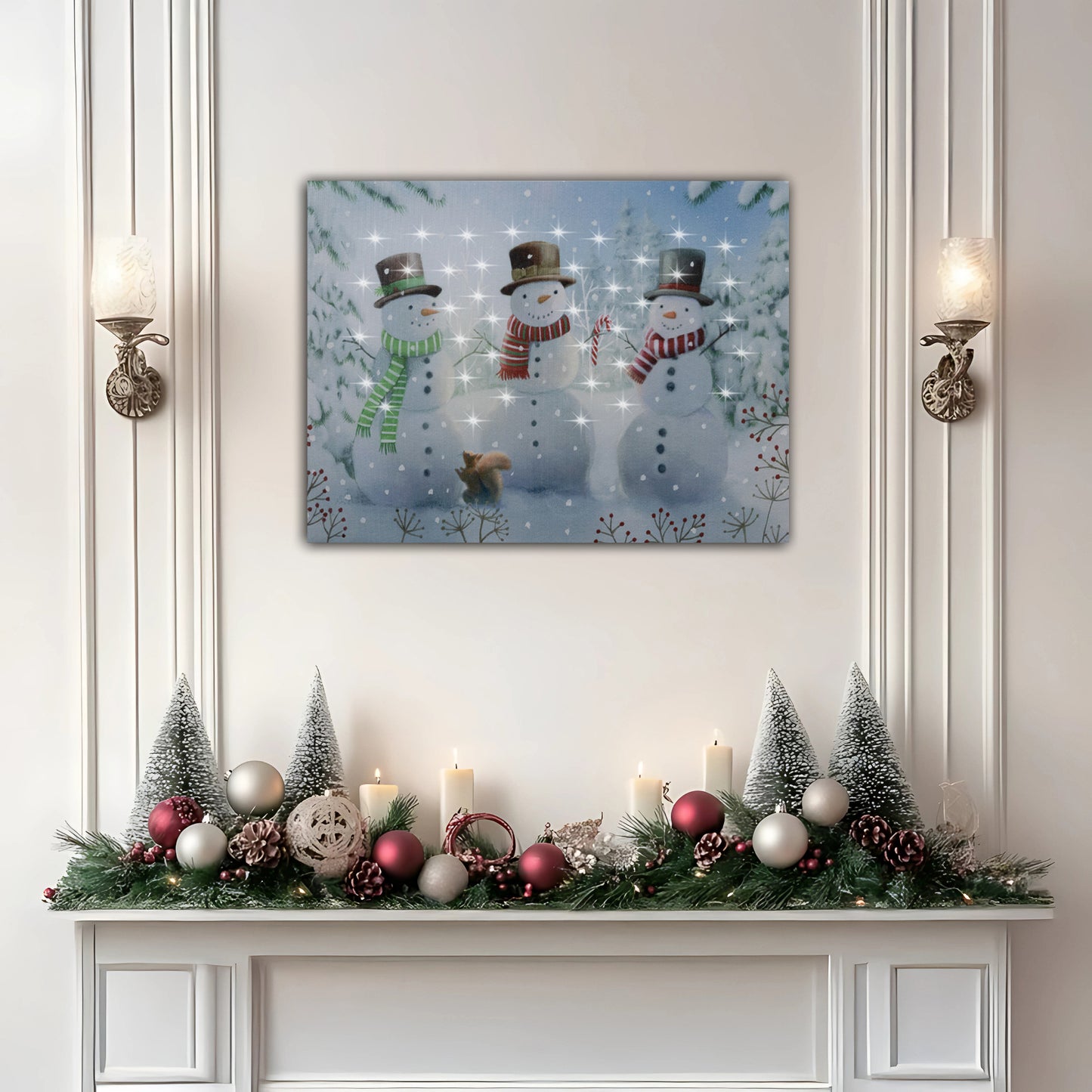 Decorative Christmas mantel with snowmen painting, candles, and ornaments on a white wall.