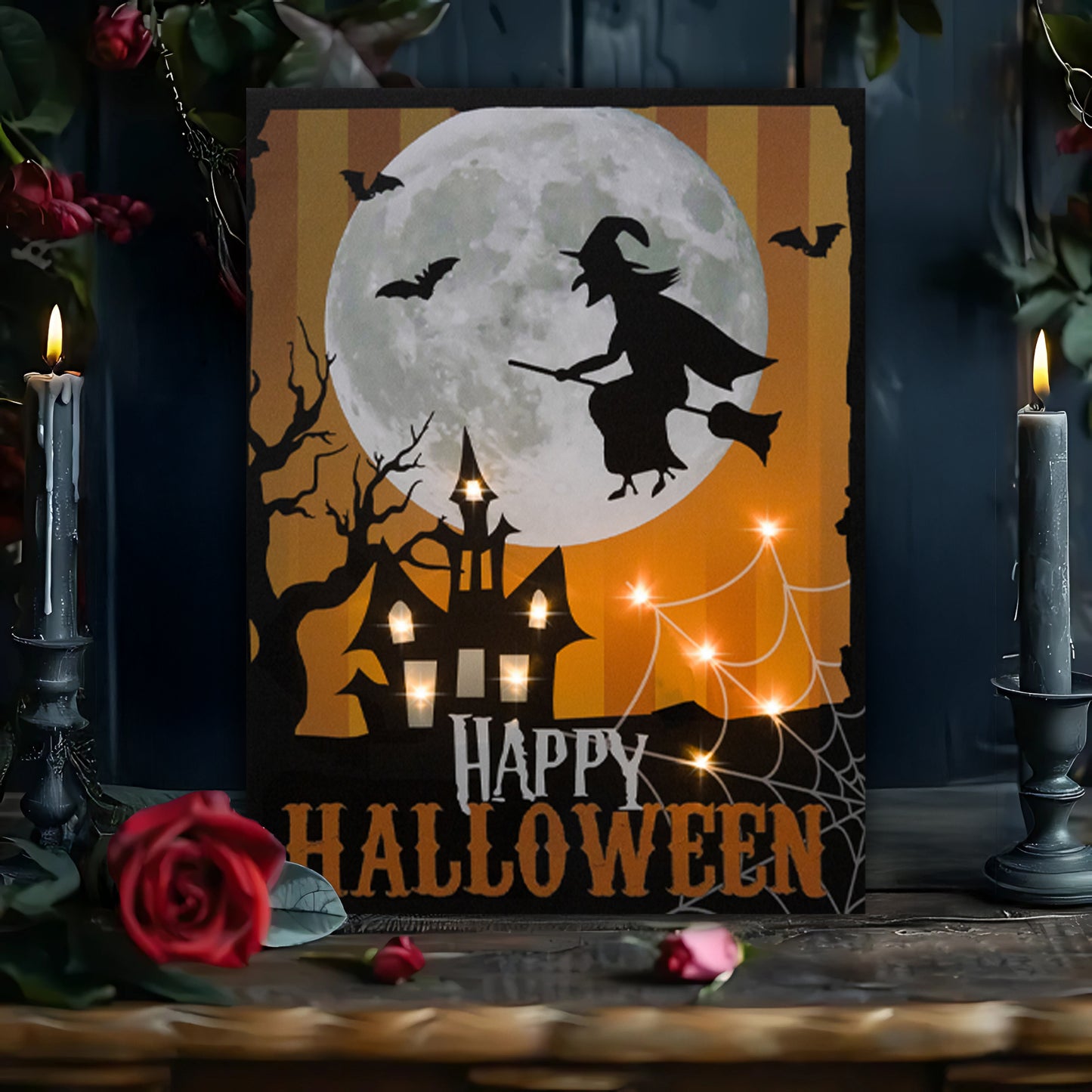 Halloween-themed decorative sign with a witch, full moon, and castle silhouette, surrounded by candles and flowers.