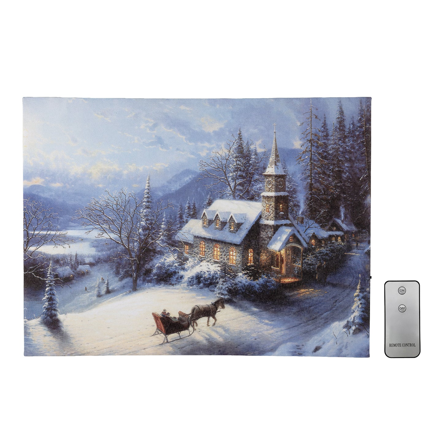 Canvas wall art winter scene with a church and sleigh, featuring a remote control on a white background.