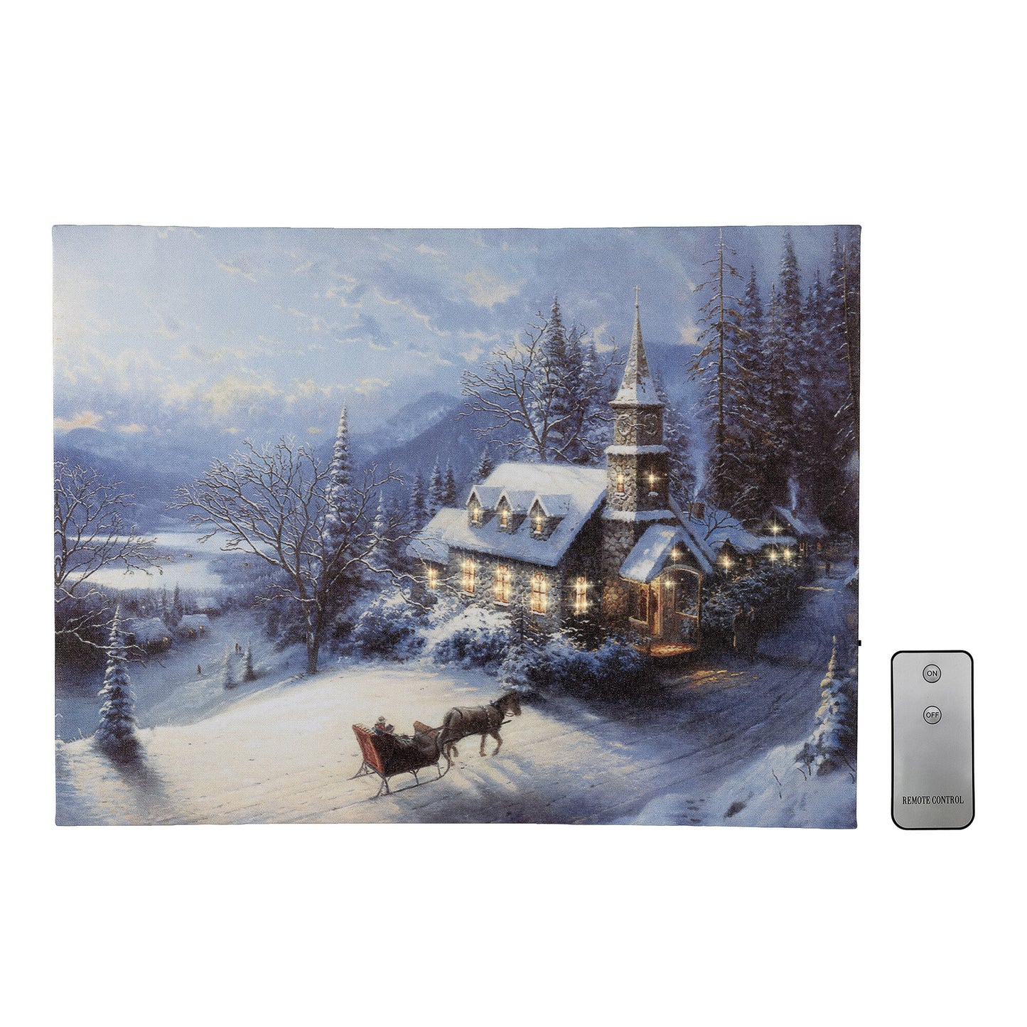 Canvas wall art winter scene with a church and sleigh, featuring a remote control on a white background.