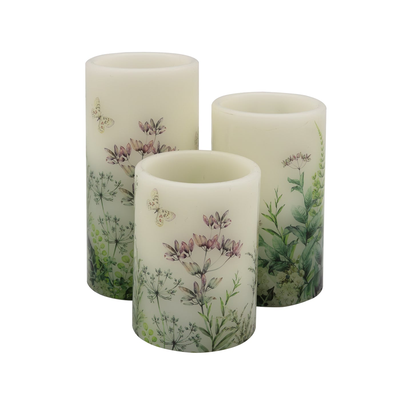 A set of three battery operated white wax candles with floral designs, greenery and butterfly motifs, featuring an amber flickering LED light.