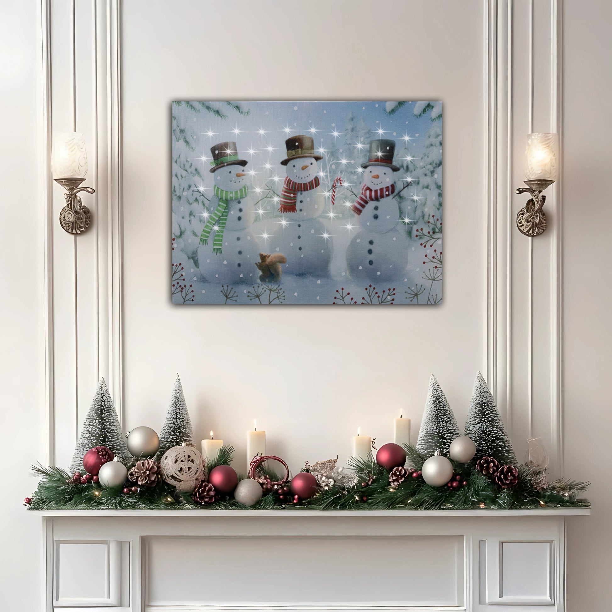 Decorative Christmas mantel with snowmen painting, candles, and ornaments on a white wall.