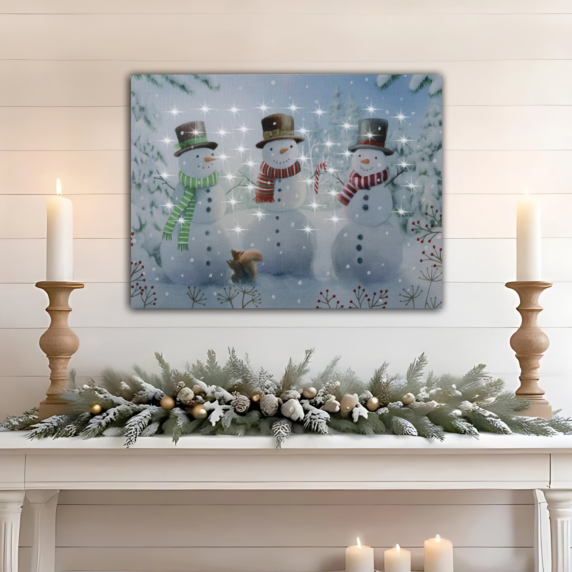 Decorative Christmas scene with snowmen, a deer, and candles on a mantel.