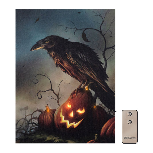 A battery operated lighted wall art featuring a raven perched on top of a jack o'lantern with a Halloween theme.