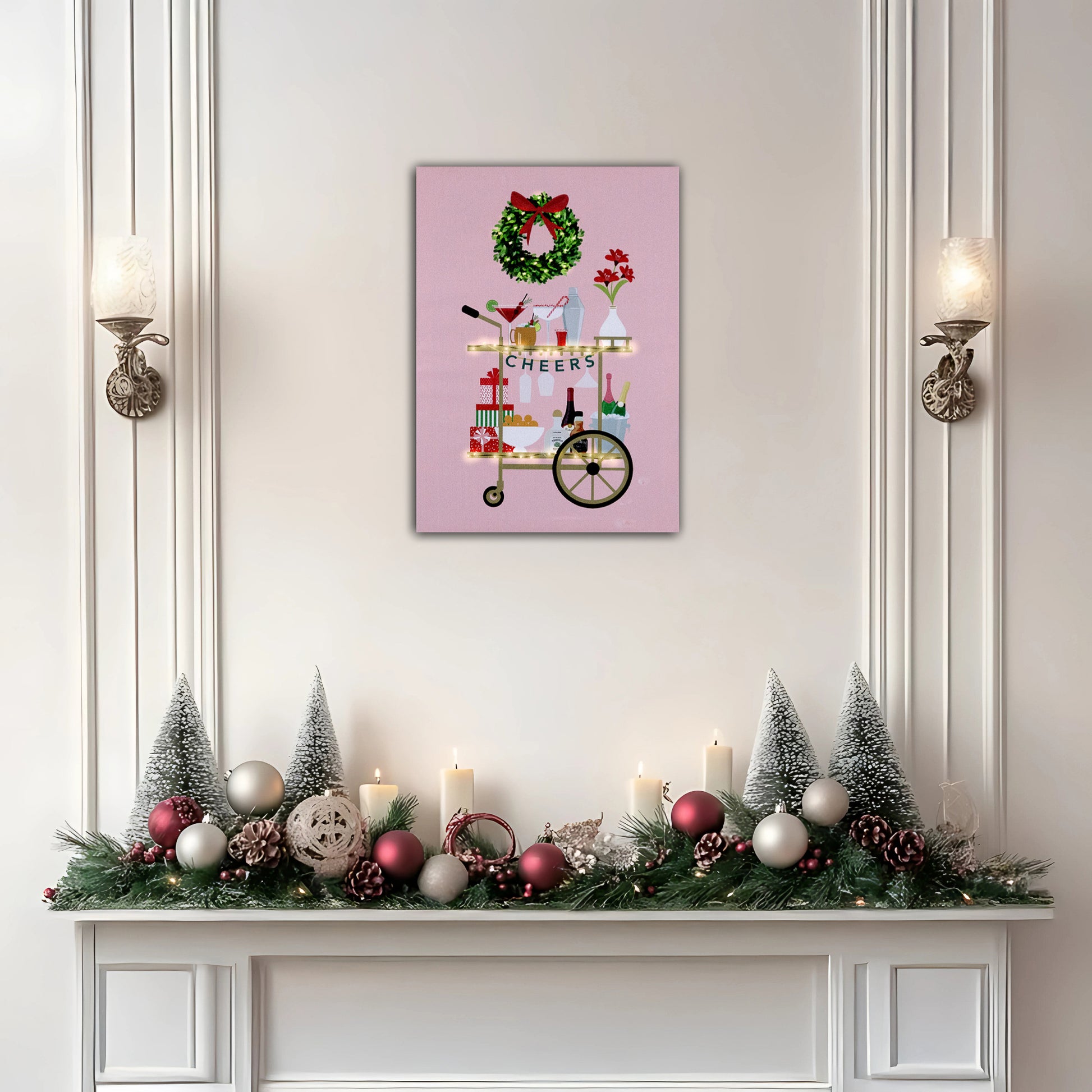 Decorative Christmas mantel with festive decorations and a framed artwork on the wall.