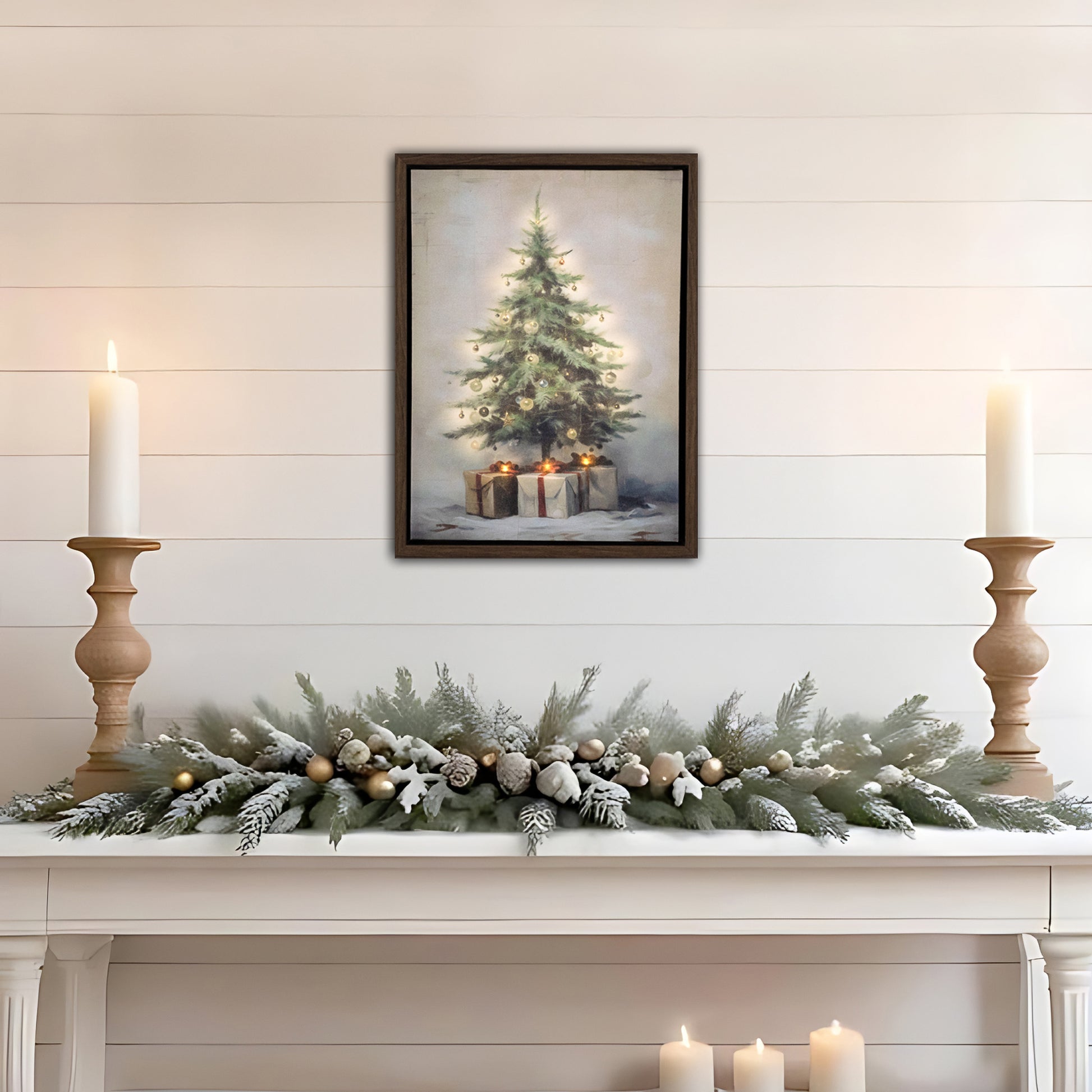 Decorative Christmas mantel with garland, candles, and framed artwork of a Christmas tree.