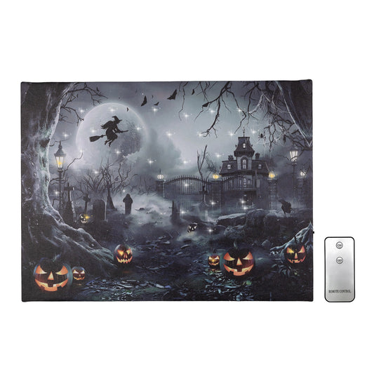 A piece of lighted wall art featuring a spooky Halloween theme with a silhouette of a witch, a full moon, a haunted house, tombstones, and jack o'lanterns against a night sky, illuminated by LED lights. Includes a remote control.