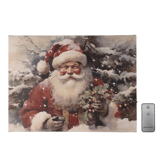 Battery operated lighted wall art depicting Santa Claus with a bough of holly berries in a snow-covered forest. Includes a remote control.