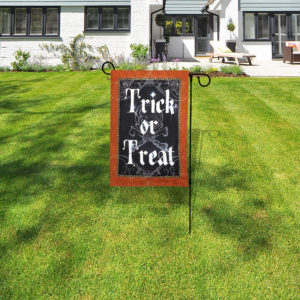 Halloween garden flag stand with lights in front lawn.Halloween garden flag stand with lights in front lawn.