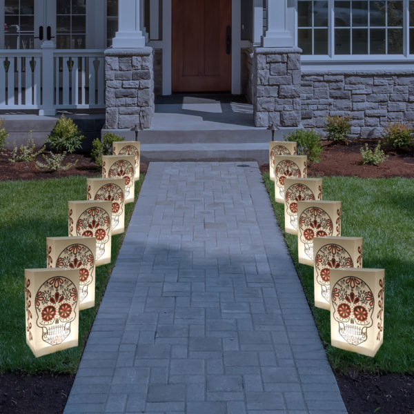 Halloween Luminaries Bags with Battery Operated Light and Sugar Skull Design Along Front Lawn Path.