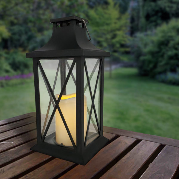 Solar powered lantern on a picnic table outdoors